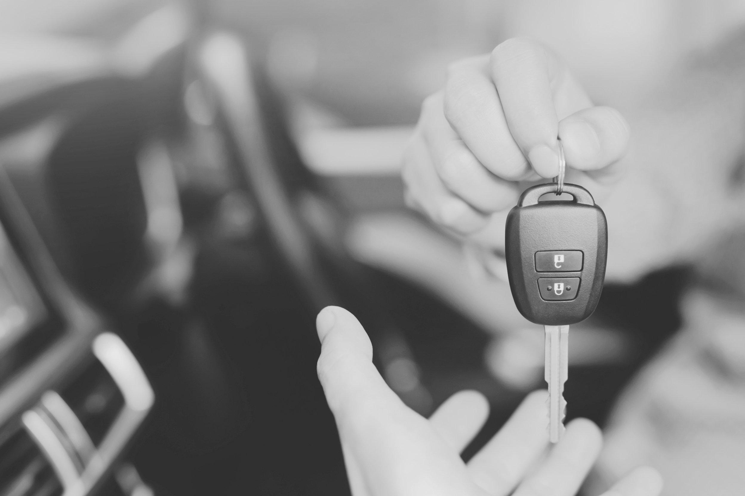 Man Handing Over a Car Key