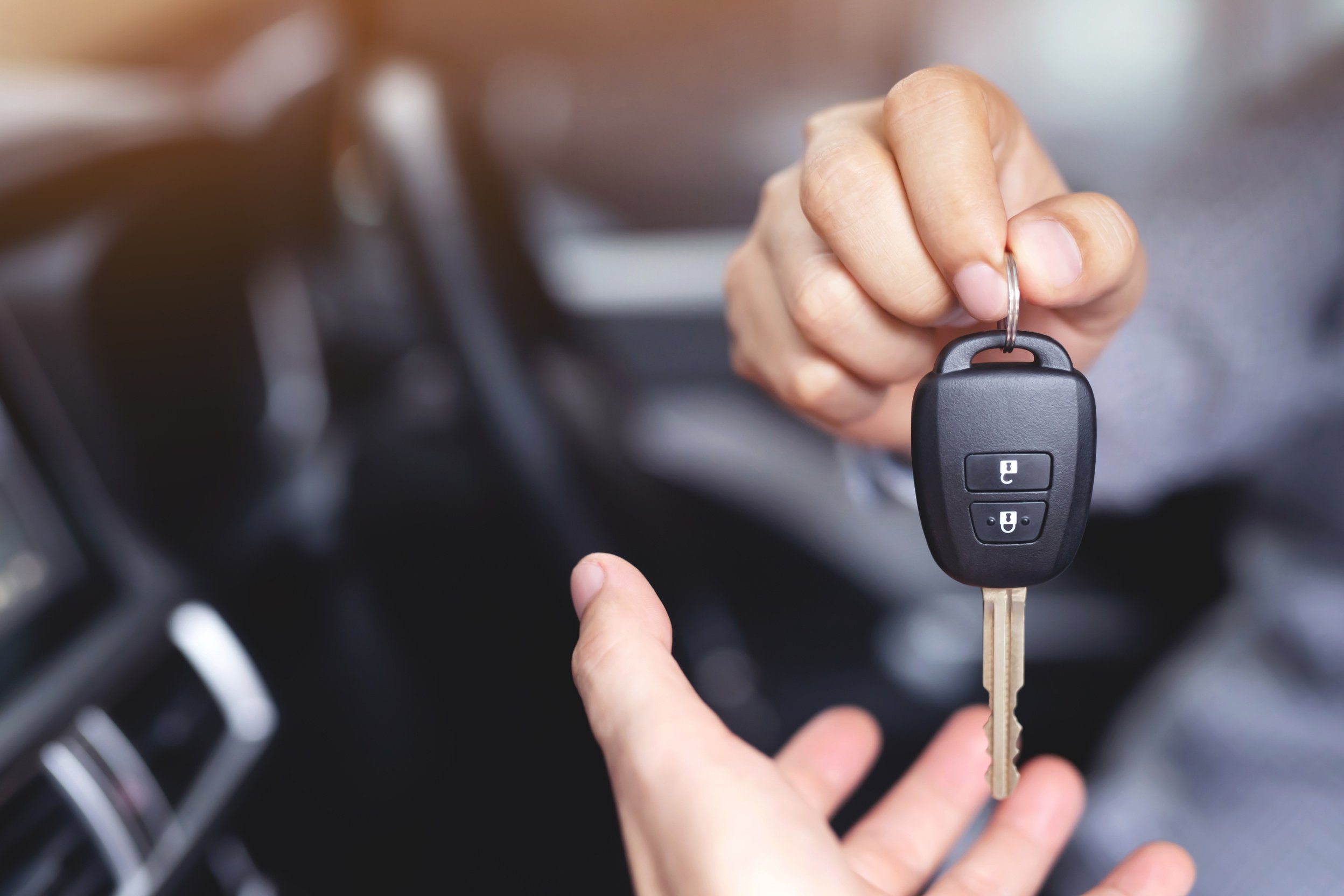 Man Handing Over a Car Key