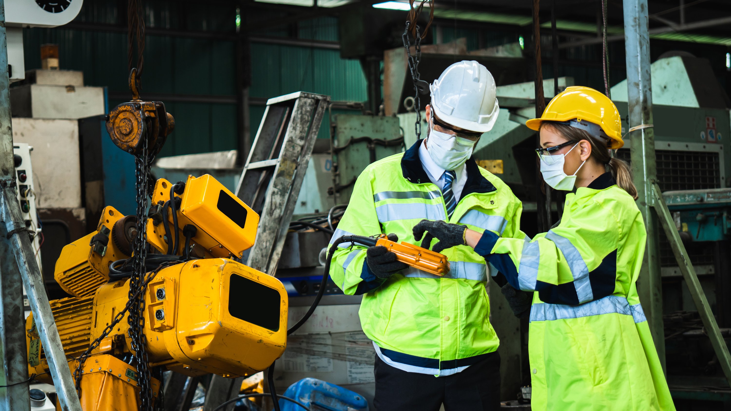 Industrial Engineer in Suite and Safety Helmet Working in Factor